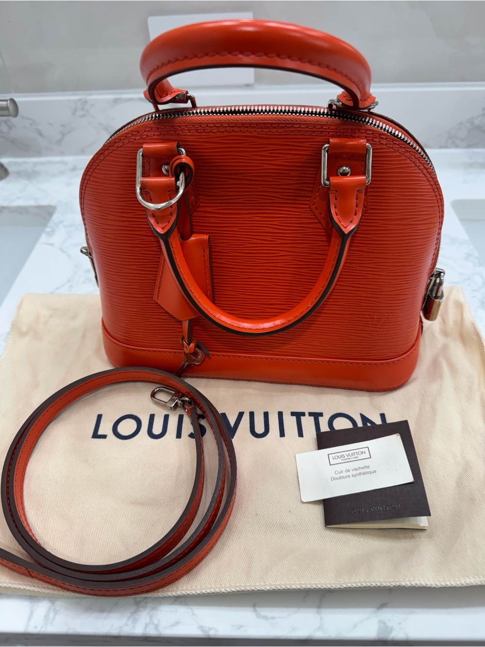Louis Vuitton Orange Epi Alma BB Satchel with Strap
